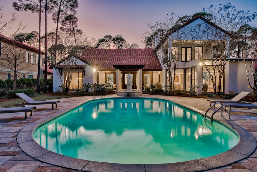 New Orleans Mastery meets Coastal Color in this fully and beautifully renovated Burnt Pine transitional home that captures lake and golf course views. Timelessly sophisticated interiors are intensified by 120-year-old reclaimed heart-of-pine, wide-plank flooring, dark-framed windows, solid cypress beams, wrought-iron accents, and limestone archways. Indoor allure blends seamlessly with back-yard immenseness that is highlighted by a 20' X 40' private pool. This 6,407-square-foot stucco, five bedroom, five bath home is the epitome of luxury coastal-contemporary design that both celebrates its natural surround and innovates the beachy locale. Sleek lines, organic materials, airy spaces, bold hue accents, and a wealth of sunlight define its signature style.