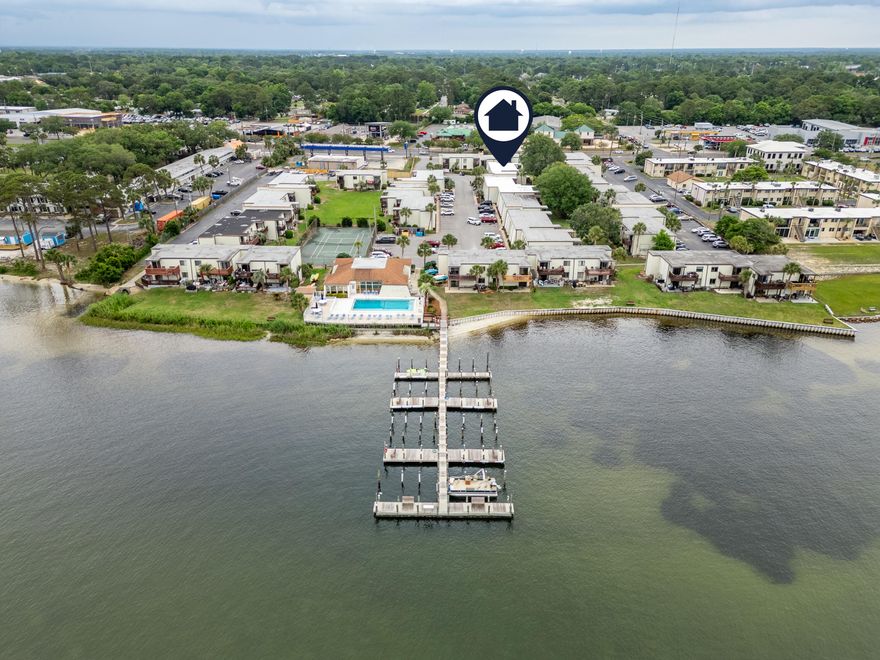 Ready to live the waterfront dream? Imagine waking up to the gentle lapping of waves and the breathtaking views of the Santa Rosa Sound right outside your unit. Introducing your slice of paradise at our stunning condominium complex. This isn't just a home; it's a lifestyle! Picture yourself stepping out your door and onto your boat, conveniently docked just moments away in our private boat slips. Spend your days cruising the sound, fishing in the Gulf, or simply soaking up the Florida sunshine.But the allure doesn't stop there. Dive into relaxation at our sparkling sound-front swimming pool, where you can cool off while enjoying panoramic water views. Gather with friends and neighbors in our welcoming community room, perfect for social events and making lasting connections. Stay active and enjoy a friendly match on our well-maintained tennis courts. And when you're ready for some sand between your toes, our private beach awaits!
Inside this beautifully remodeled one-bedroom, one-bath unit, you'll find modern comfort and style. Step onto brand new flooring that flows seamlessly throughout the space. Updated light fixtures illuminate the fresh ambiance, while sleek aluminconn plugs add a touch of contemporary convenience. Forget trips to the laundromat - a new stackable washer and dryer are conveniently tucked away in the master bedroom closet. The bathroom offers a stylish new vanity and a refreshing shower.
This isn't just a place to live; it's an invitation to embrace the vibrant waterfront lifestyle you've always dreamed of. Don't miss this incredible opportunity to own your piece of paradise on the Santa Rosa Sound! Unit comes completely furnished, including decor, artwork, dishes, cookware, linens, etc. at no additional costs.
