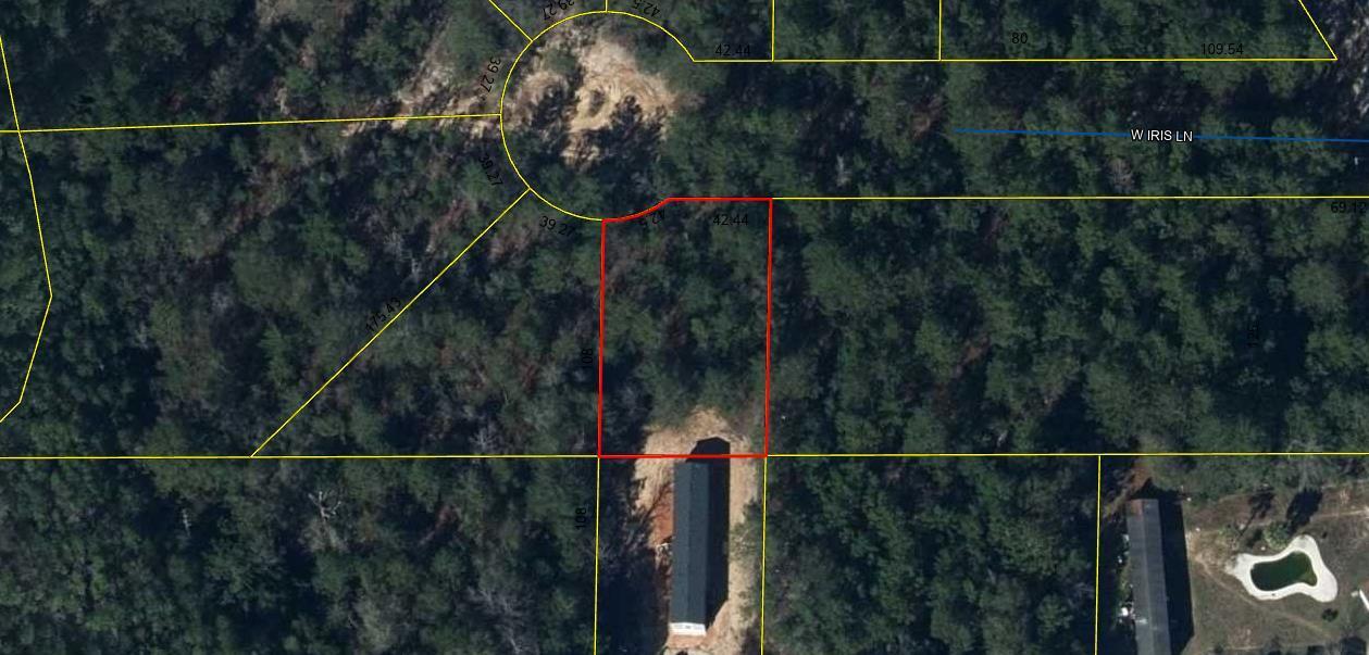 Vacant wooded lot just off a paved road. Mobile homes welcome.