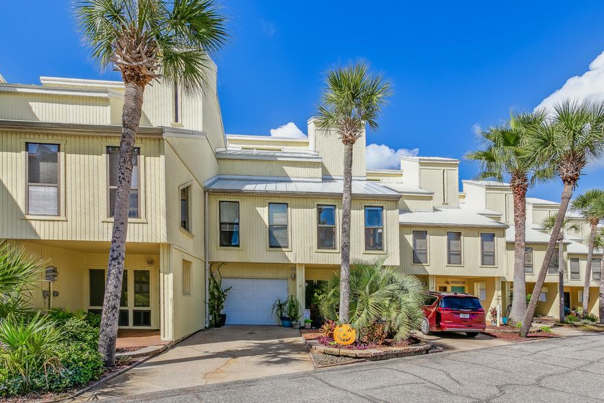 This beautifully updated and meticulously maintained townhome on Navarre Beach offers the perfect vacation home and short-term rentals allowed. It features a deep water boat slip with a lift that can accommodate a boat or jet skis. Inside, you'll find  three bedrooms, two bathrooms, and two oversized bonus rooms. The second floor offers an open split floor plan, seamlessly connecting the living, dining and kitchen spaces and opens to a spacious Trex deck, perfect for outdoor relaxation and entertaining. Additional features include a two car garage, a substantial covered patio area, newly installed roof, new HVAC and two water heaters. The town home's location is unbeatable, offering a pool and beach on the Santa Rosa sound or a short walk to the Gulf's white sandy beaches.