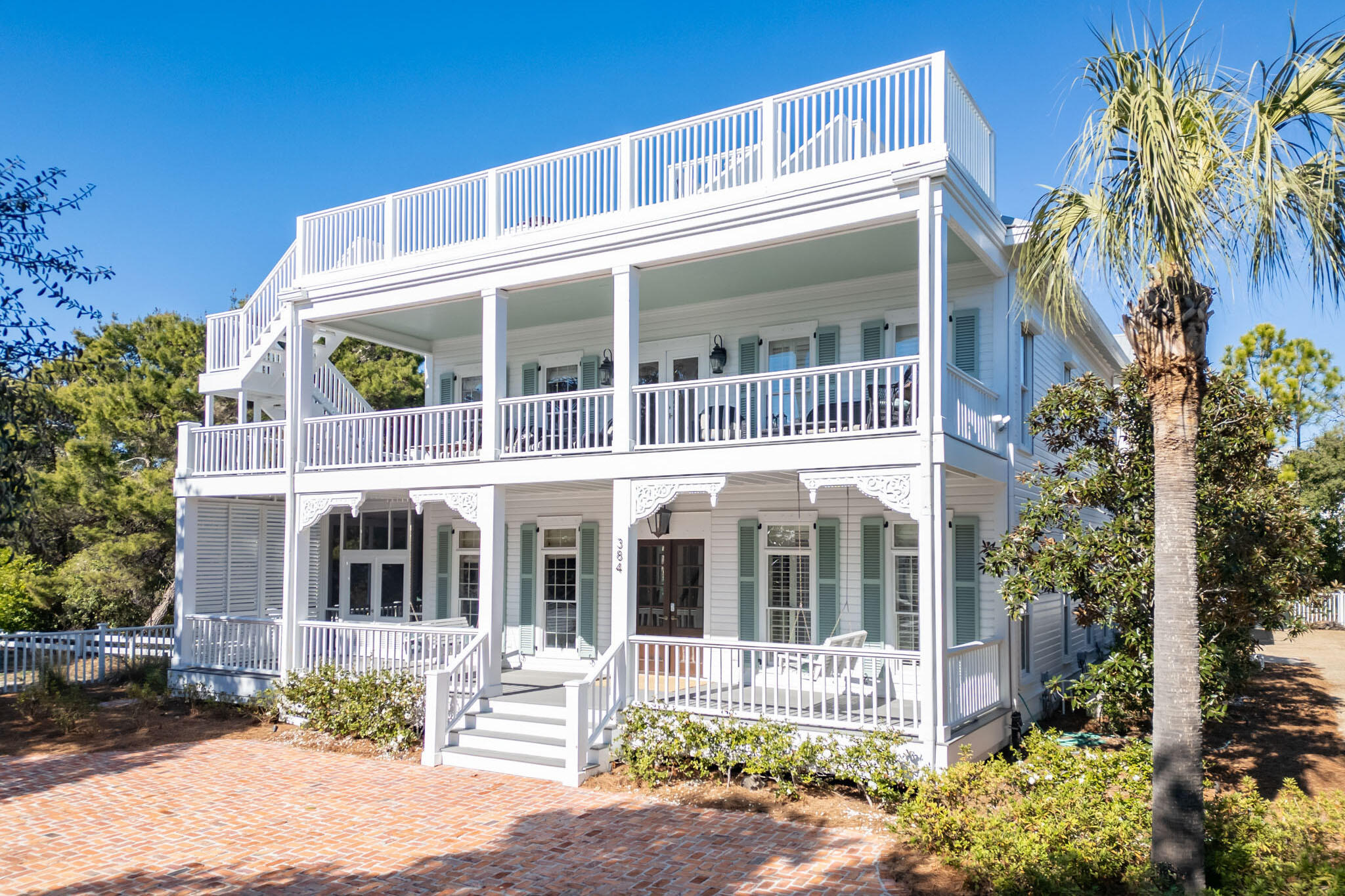 Welcome to 384 Walton Rose Lane, a luxurious coastal getaway where timeless elegance meets refined design in the heart of Inlet Beach along coveted Scenic Highway 30A. Perfectly blending contemporary style with classic coastal charm, this estate offers a unique opportunity to experience the best of Gulf Coast living. From the moment you arrive, you'll be captivated by the home's iconic porches, complete with classic swings on the first and second floors, reminiscent of a New Orleans French Quarter retreat. A screened patio is nestled around the corner from the front entry, offering a relaxing haven just off the interior dining nook of this luxury property. 

The main entrance greets you with a comfortable open living space, bathed in natural light, soaring ceilings, and meticulous craftsmanship. The gourmet kitchen features an oversized island, custom cabinetry, a gas stove, and top-of-the-line appliances, making it the perfect space for entertaining. The window wrapped dining room flows easily from the kitchen, sun drenched with designer finishes from floor to ceiling. The main floor is completed with a first-floor guest room with en-suite bath, private office space, laundry room, and powder room.

The primary suite anchors the second floor with a private fireplace, crown-molding, space for lounging accented by a luxurious bath with access to the second story porch. You'll enjoy the same high-end designer furnishings and finishes throughout the additional guest rooms on the second floor, and double bunks tucked into the side of the second floor landing. 

The interior seamlessly extends outdoors to a private, serene oasis. This large oversized private lot features a modernized in-ground heated pool surrounded by lush landscaping, and an expansive outdoor kitchen, setting the stage for relaxation and recreation. The main house and carriage home define a tranquil courtyard offering expansive outdoor entertaining space. 

The carriage house/garage, added in 2018, offers additional living quarters, ideal for 2-6 guests,  with a full kitchen, bedroom, bunk area, bathroom, and a private deck overlooking the pool. The garage has tons of storage and epoxy flooring.  Ample parking is available with an oversized two-car garage, in addition to the space for 10+ vehicles at the front of the home on the brick paver drive.

A true highlight is the widow's watch deck, offering spectacular 360-degree views of the Gulf of Mexico, Rosemary Beach, and vivid sunsets. Thoughtfully located just a parcel away from Rosemary Beach and only 800ft to the sugar-white sands and emerald waters, unique to our slice of paradise, this home provides unparalleled access to the Gulf and is moments away from Rosemary Beach's fine dining, boutique shopping, and vibrant activities.

Described by friends and family as "charming," "inviting," and "perfect," this property is not only a peaceful retreat but also an exceptional investment opportunity. Whether you're seeking a vacation home on 30A, a primary residence, or a premium investment property, 384 Walton Rose Lane embodies the pinnacle of coastal luxury.

Schedule your private tour today and experience this exquisite 30A estate for yourself!

All information deemed to be correct but should be verified.

