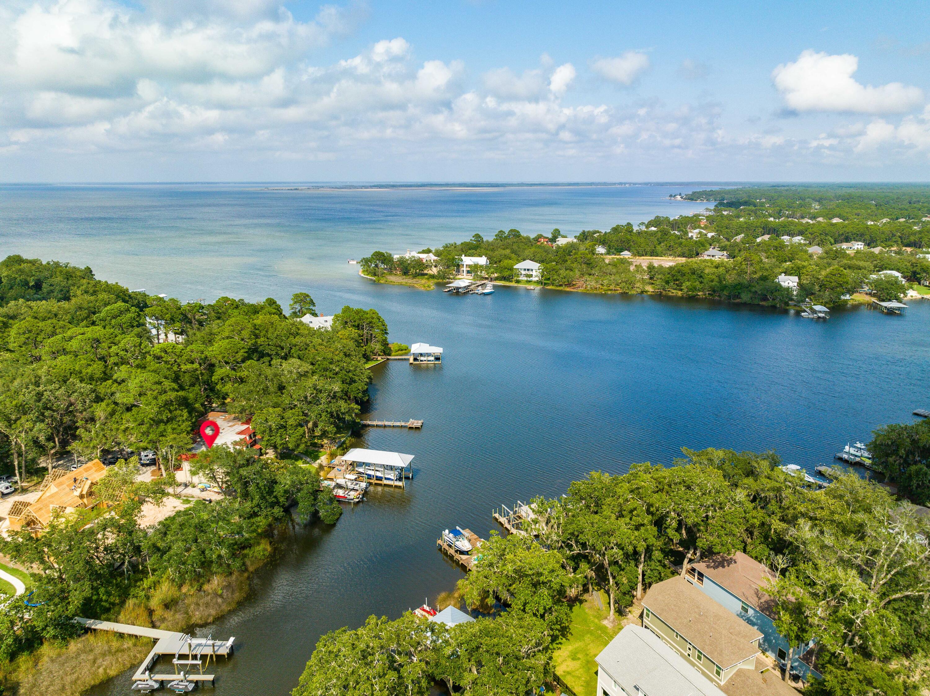 **OPEN HOUSE 12/29 from 1 - 3 PM**  Seller offering $10K credit to Buyer for closings cost or pre-paids! SHORT TERM AND LONG TERM RENTALS POSSIBLE. Welcome to this stunning bayfront home nestled in the serene community of Santa Rosa Beach, Florida. This  newly updated residence boasts a spacious 1,600 square feet of living space with 2 bedrooms and 2 bathrooms. Additionally, a dedicated office or bunk room offers versatile space to suit your needs, whether for work or extra guests.Step into an open floor plan that's bathed in natural light from oversized windows, revealing breathtaking views of the bay. The large kitchen is a chef's dream featuring modern stainless steel appliances and beautiful finishes. Each bedroom comes equipped with walk-in closets for ample storage. One of the standout features of this property is its bayfront location. Enjoy unobstructed bay views right from your doors. Make use of your very own deepwater boat slip - 20 steps from your back door! If you have a boat or are considering one, you'll appreciate having your own private boat slip accommodating a 30' boat or larger with modifications.

Quality upgrades include durable LVP flooring throughout, a new HVAC system, and new kitchen and bathrooms.

This property offers easy access to Highway 30A and Grand Boulevard's shopping and dining establishments as well as Sandestin Golf & Beach Resort. For healthcare needs, Sacred Heart Hospital is just within two miles from the home.

Santa Rosa Beach provides not just a place to live but also an enviable lifestyle. Enjoy outdoor activities like beachcombing, surfing and paddleboarding on the emerald waters of Florida's Gulf Coast. Further explore nature by taking scenic bike rides or leisurely walks along the Timpoochee Trail.

This impressive home presents a unique opportunity to enjoy comfortable living while being close to all conveniences. Whether you're looking for a peaceful retreat or an exciting adventure, this property offers it all without compromise.
