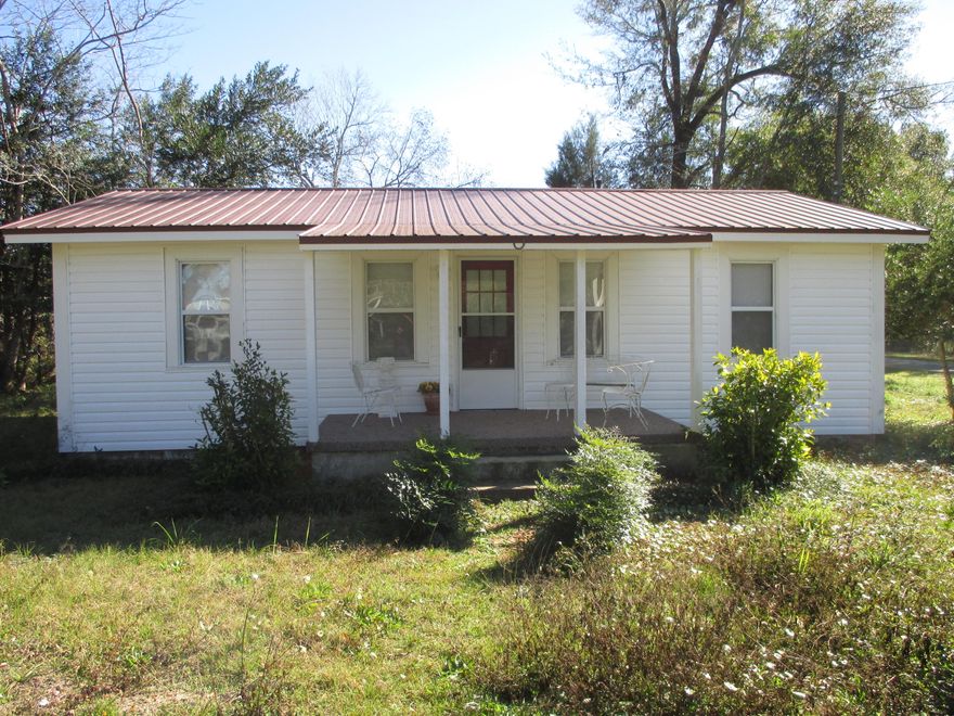 Well maintained home in the city of DeFuniak Springs. Attractive corner lot is nicely landscaped. New metal roof installed in 2009 and new vinyl siding also. Dining room/kitchen and living room has hardwood floors. Screened back porch. See this attractive home today.