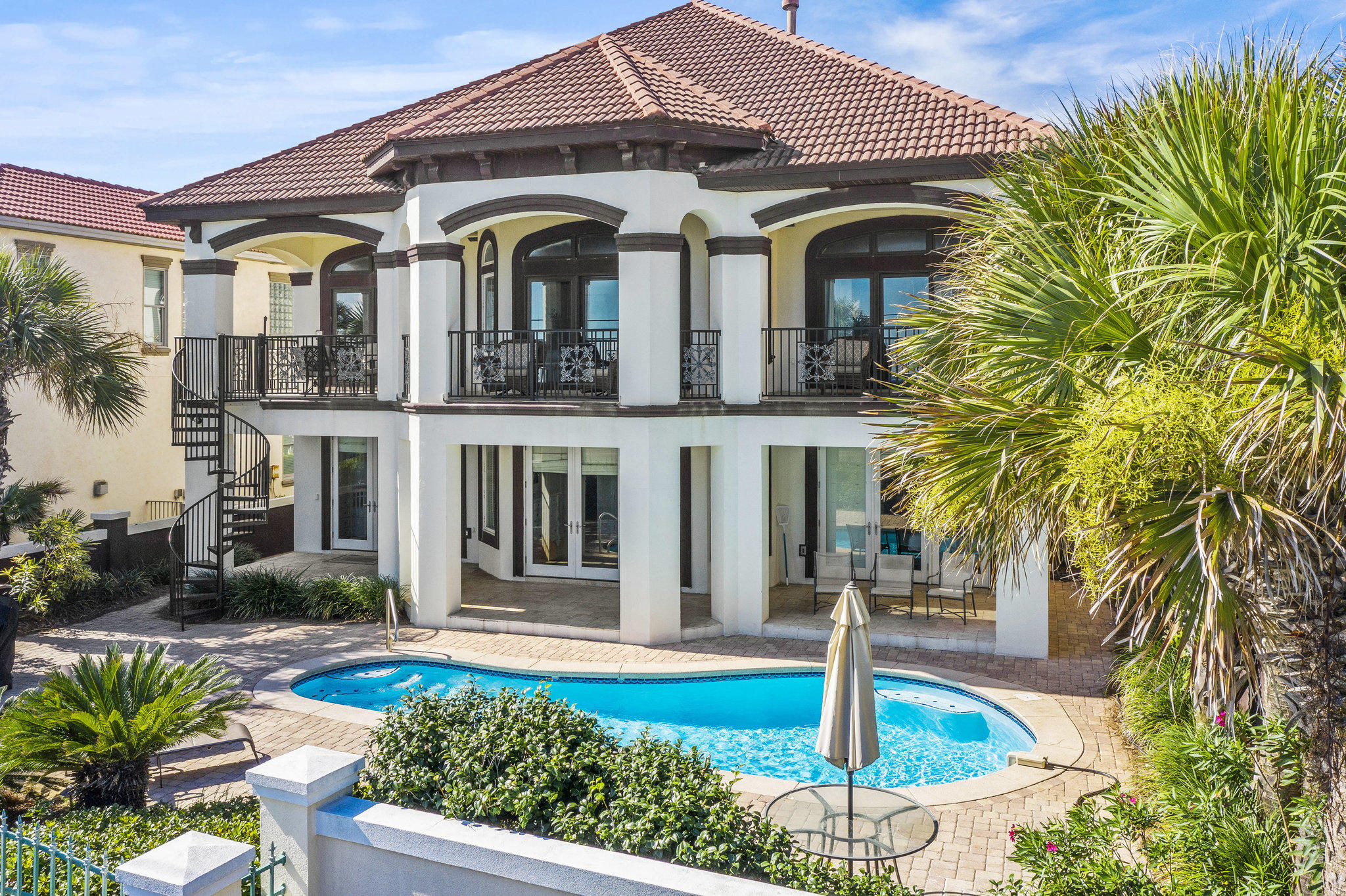 BREATHTAKING five bedroom, five and a half bath house overlooking the Gulf of Mexico and the beach. As you enter this magnificent home you walk into pure luxury. The first floor is equipped with three bedrooms, three bathrooms, an entertainment/game room, wet bar and large laundry room. Two of the bedrooms exit out to the sparkling pool and deck area. The elegant staircase takes you to the second floor where you are welcomed by expansive views of the beautiful emerald water. Kitchen, dining, and living areas are open concept allowing for great entertainment flow and space. You will also find two bedrooms and two and a half baths on this floor - one is the master suite facing the Gulf of Mexico where the waves can lull you to sleep.