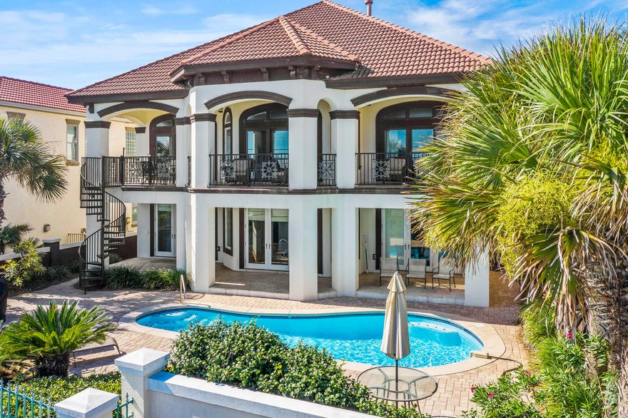 BREATHTAKING five bedroom, five and a half bath house overlooking the Gulf of Mexico and the beach.  As you enter this magnificent home you walk into pure luxury. The first floor is equipped with three bedrooms, three bathrooms, an entertainment/game room, wet bar and large laundry room. Two of the bedrooms exit out to the sparkling pool and deck area. The elegant staircase takes you to the second floor where you are welcomed by expansive views of the beautiful emerald water.  Kitchen, dining, and living areas are open concept allowing for great entertainment flow and space. You will also find two bedrooms and two and a half baths on this floor - one is the master suite facing the Gulf of Mexico where the waves can lull you to sleep.