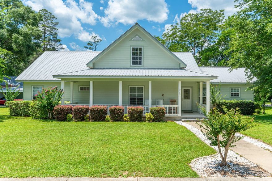 Explore this charming home nestled in the Historic District of DeFuniak Springs, just steps away from Lake DeFuniak Lakeyard. Meticulously designed, this residence boasts a spacious eat-in kitchen with oak cabinets, a walk-in pantry, and a convenient desk area. The living room features soaring 9 ft. ceilings throughout the downstairs.The master bedroom offers a large walk-in closet and a master bath with a spacious shower and linen closet, while the second bedroom also includes a walk-in closet. Ample storage is available with three closets in the hallway, and the laundry room provides extra cabinets and counters. Upstairs, the home expands to over 2,300 square feet, offering flexibility for additional living space or storage. Moreover, the entire downstairs is ADA handicap accessible,