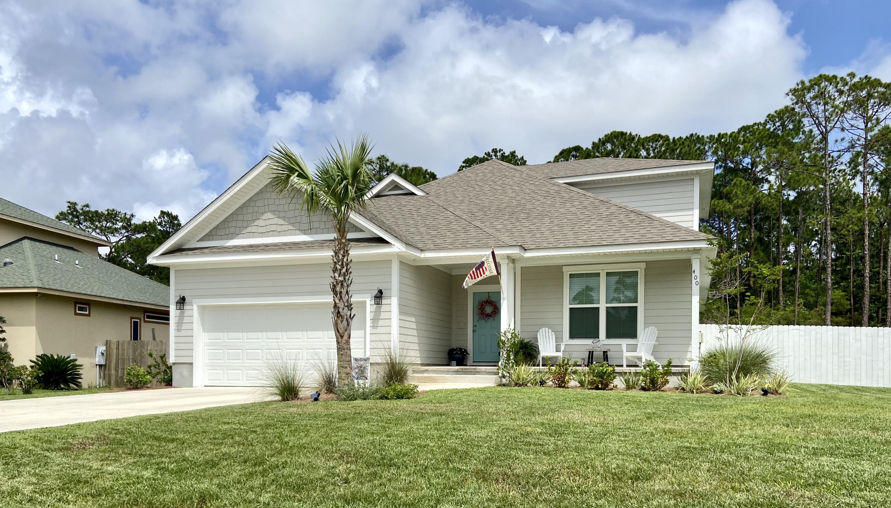 Custom home in GATED bay front subdivision close to everything. Beautifully landscaped and backing up to wooded area. You will see the pride in ownership when viewing this home. Highly sought after open floor plan with beautiful LVF and tile throughout the downstairs. Open floor plan in this almost new home. Downstairs you'll enjoy master bedroom and two bedrooms. Upstairs is a large ensuite. Kitchen offers beautiful white cabinets, soft close drawers and lazy susan in the corner cabinet with complimenting granite countertops and a spacious pantry. Master bedroom features two closets, double vanity granite countertops, separate shower and amazing soaking tub. Head outside to relax on your porch and listen to the birds while viewing the beautiful trees in the preserve area.