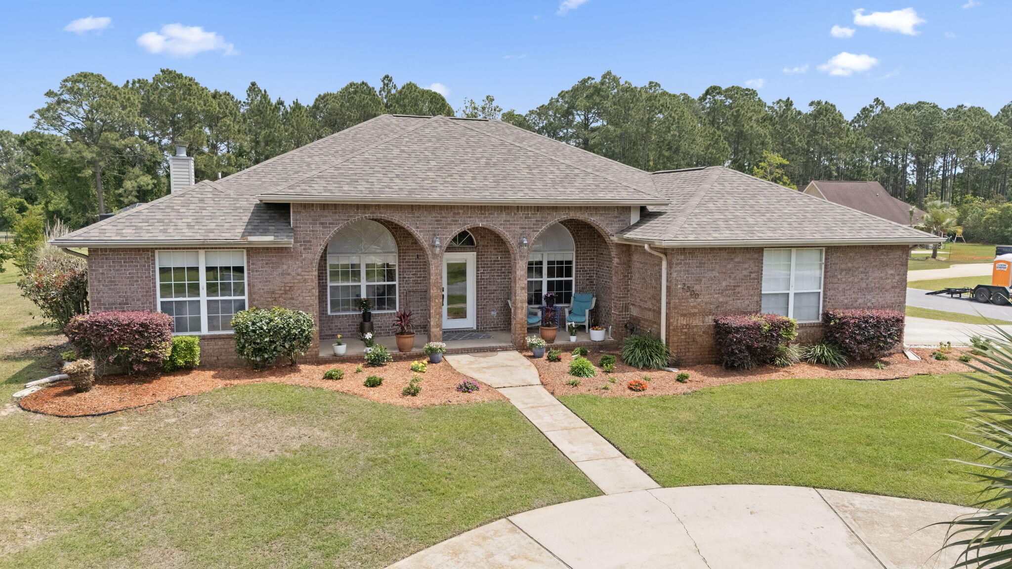 VA Assumable at 2.75%! Tucked between the 6th and 7th holes of Hidden Creek Golf Course, this well-maintained all-brick home offers both comfort and space in the sought-after Holley by the Sea community. The community includes tennis courts, pickle ball, fitness facility, boat dock, fishing pier, event space, basketball courts, playgrounds, lap pool, family pool and MORE! Situated on a corner lot, this 4 bedroom, 2 bath home features no carpet, a spacious flex room with a cozy fireplace, and a screened, covered back patio--perfect for enjoying peaceful mornings or evening breezes. A 3-car garage adds plenty of room for vehicles, hobbies, or storage. Roof 2021, HVAC 2022, Water Heater 2023 + $20k in additional upgrades since 2021. The large kitchen flows into a sunny breakfast nook and connects to a formal dining room, making it great for everyday living or entertaining. With thoughtful updates and a prime golf course location, this home is ready for you to move in and make it your own.
