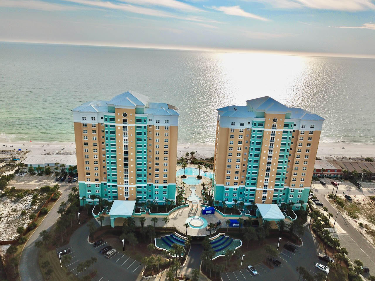 Mediterranean coastal elegance--En Soleil is Panama City Beach's best luxury resort directly on the sugar white sand! Soak in the sunset on your balcony! This unit is located on the west end of the east tower overlooking the gorgeous Gulf. All walkways and elevators are indoors-no need to worry about getting rained on carrying your groceries! The parking space is under the building with elevator access from parking to your floor- all indoors, and the resort is gated for security. The floor plan has unmatched utility. Enter the home through the grand double doors into the foyer. There are two bedrooms with on suite bathrooms, both offering the serene views of the Gulf! The master bedroom has slider doors opening to the HUGE balcony. There is an oversized laundry room with side by side washer and dryer. Both air conditioners and water heater are new- AC x 2 2020, water heater 2021. Large travertine tile covers the floors in the entire main areas of the unit. The kitchen has beautiful granite countertops and stainless steel appliances, upgraded custom quality cabinets, travertine accents around the breakfast bar, and a waterscape custom backsplash. The master bathroom has modernistic free flowing brushed nickel faucets and a custom, high gloss, waterscape tile backsplash. The bathrooms have decorative back splashes, upgraded tile showers. The master bath has an upgraded custom travertine shower and a jetted tub set in granite casing. The oversized balcony has terrific space to enjoy entertaining with a built in outdoor grill with counter space and storage! You won't miss having a backyard in this condo! There is a sizable owner's closet/locker near the front entry. Amenities abound with 24 hr guard and gate security; a Gulf front fitness center; 450 ft of Gulf front, hot tubs and waterfalls; 6500 sq ft of Gulf front pools surrounded by gorgeous patio areas. There are only three units per floor, per building, so no high density. En Soleil is truly a unique Gulf Coast resort experience in Panama City Beach! The location is in the lower traffic portion of Panama City Beach, while just a few miles from the area's best shopping and just down the street from some of the area's best parks and boating. Parking space #7 and owners closet convey.