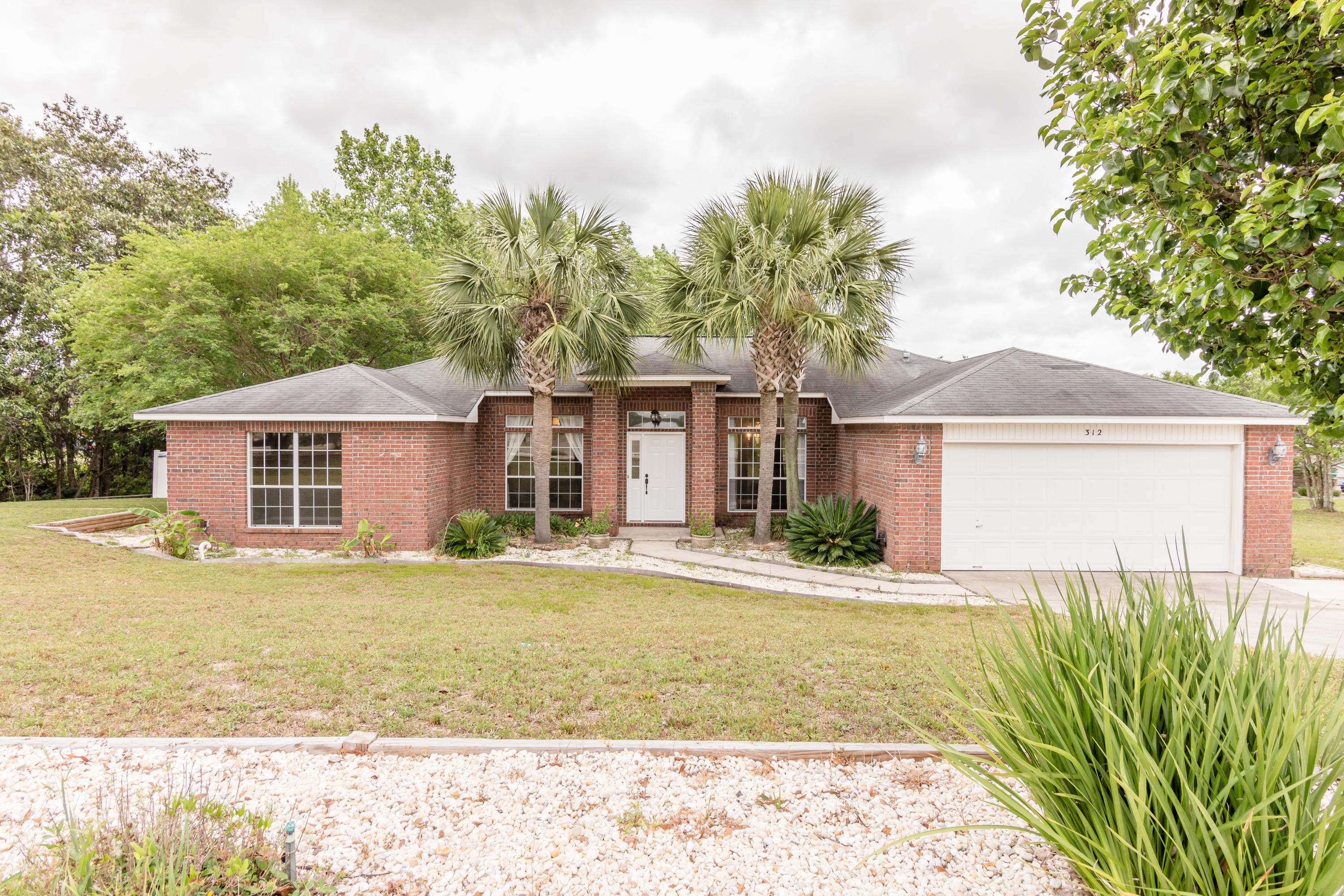 This exquisite 4-bedroom 2-bath home located in South Crestview is move in ready! This home features large bedrooms, tall ceilings and sits on a very large lot. The kitchen includes plenty of cabinet space, a large island as well as a quaint dining area. The master bath features double vanities, large tub with a separate shower and a spacious walk-in closet. Enjoy spending time outdoors in the spacious back yard that includes a privacy fence. This home is just a short commute to 7SFG, Duke Field, Eglin AFB and the beaches.