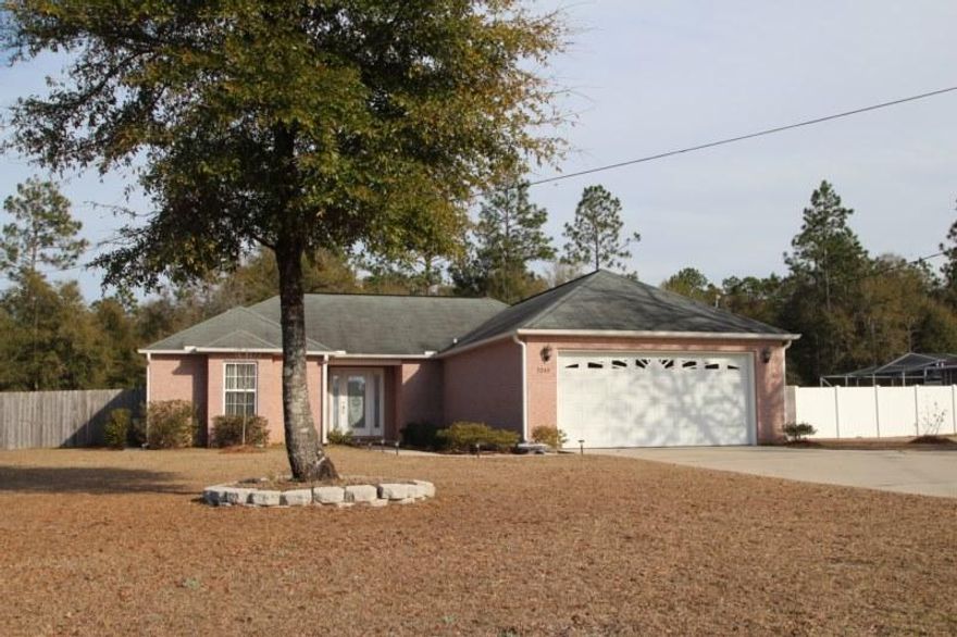 Wonderful all brick home centrally located in Baker. This well maintained home features three bedrooms and two full baths, a large living room, separate dining area and breakfast bar. Lovely treyed ceilings in the dining area and master bedroom. Split bedroom design with a nice sized master suite on one side and two secondary bedrooms and a bath on the other. LARGE LOT IS ONE HALF ACRE and the nice back yard is privacy fenced and the rear patio is covered. Seller will leave the two sheds and one is practically brand new. That means you could actually park your cars in your two car garage with auto opener!! Roomy kitchen with loads of cabinets and an inside laundry room. New side by side refrigerator remains. Master bath has a tub PLUS a separate shower.