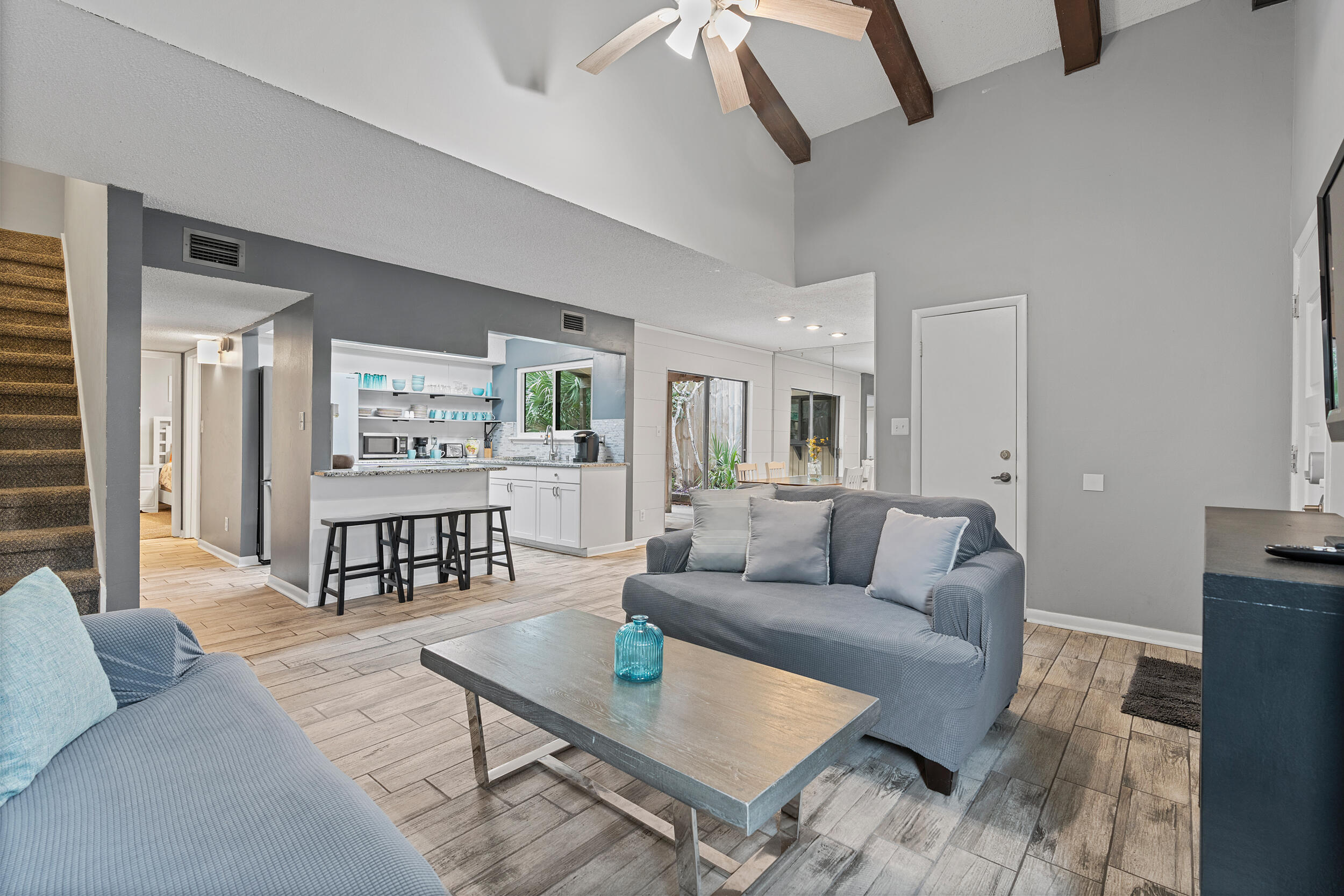 This 3 bd/2 ba two-story condo is conveniently located at the end of the street in Seascape Resort, which is a gated community in Miramar Beach. The floor plan is ideal for enjoying the beach living and can be used as a primary, second or investment property. On the first floor is 1 bedroom/1 bath, an updated kitchen opening up to the living room which has a high cathedral ceiling. The lush private patio is accessible from the dining area and is ideal for cooking barbeques etc. On the second floor are the remainder bedrooms and bath. The association replaced all windows 3 years ago and the roof was done 2 years ago. Other upgrades are patio roof, HVAC 2 years old and fridge replaced 2023. This condo villa has a garage port where you can also park your golf cart which makes