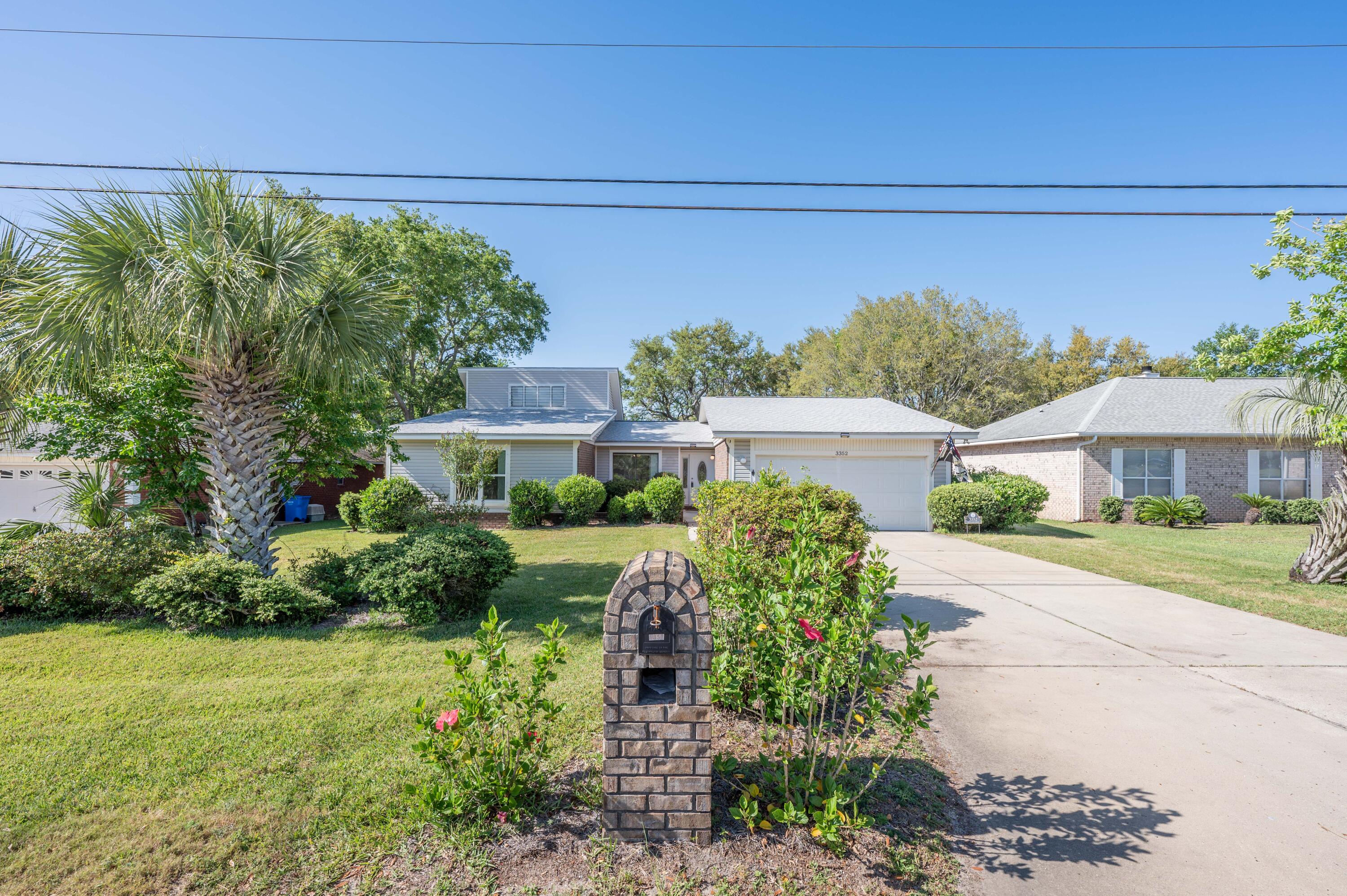 Conveniently located in Santa Rosa Shores, this 4 bedroom home offers a screen enclosed swimming pool with a massive screen enclosed porch (46x9) and a spacious living room. You'll enjoy the open floor plan with 3 separate entry onto the porch, and the split floor plan offering privacy for the primary suite. The spacious primary suite has its own door to the porch and features a walk in closet with an updated vanity. The 3 additional bedrooms are located on the opposite side of the house and share a hall bathroom with a shower/tub combo. Other mentionable features are whole house generator, HVAC just 3 years old, hurricane coverings, sprinkler system, fully fenced back yard with a privacy fence, Trex sun deck, citrus trees, utility sink in garage, ceiling fans in all bedrooms, wood burning