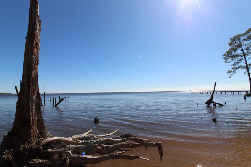 Skip the Red Tape, Start Building Now!  Imagine waking up to breathtaking panoramic views of the shimmering Choctawhatchee Bay. This is your opportunity to start building on two lots in Freeport Florida. And this is where the magic truly lies: a transferable Florida Department of Environmental Protection (FDEP) permit is already in hand! Say goodbye to the frustrating and time-consuming process of obtaining permits, which can easily take 18 months and incur significant costs. You're ready to bring your dream home to life immediately, saving you valuable time and money. 120 feet of pristine bay frontage to enjoy unparalleled water views and direct access to the Choctawhatchee Bay and a few nautical miles to the Intracoastal Waterway. Nestled away from the hustle and bustle, LaGrange Bayou