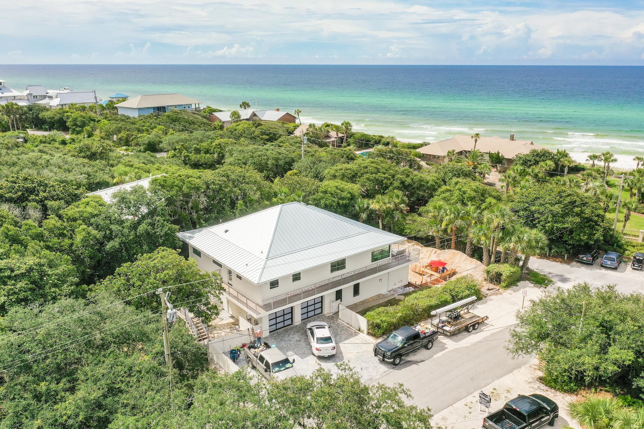 A total renovation has made this 1983 home into a modern masterpiece just steps away from the Beach Highlands walkover.  This home has 3800 sf H/C living space plus an additional 625 sf of H/C garage space.  The living area boasts 4 bedrooms with 3 full baths. An open floor plan allows for the custom kitchen to flow onto the dining, great room, and the expansive sunroom.  Large oversized windows and glass doors open onto the wrap around Brazilian hardwood deck overlooking the pool complex that will be completed the end of August. A true masterpiece of modern extraordinaire! Please refer to Documents for complete list of renovations and pool and spa specifications.