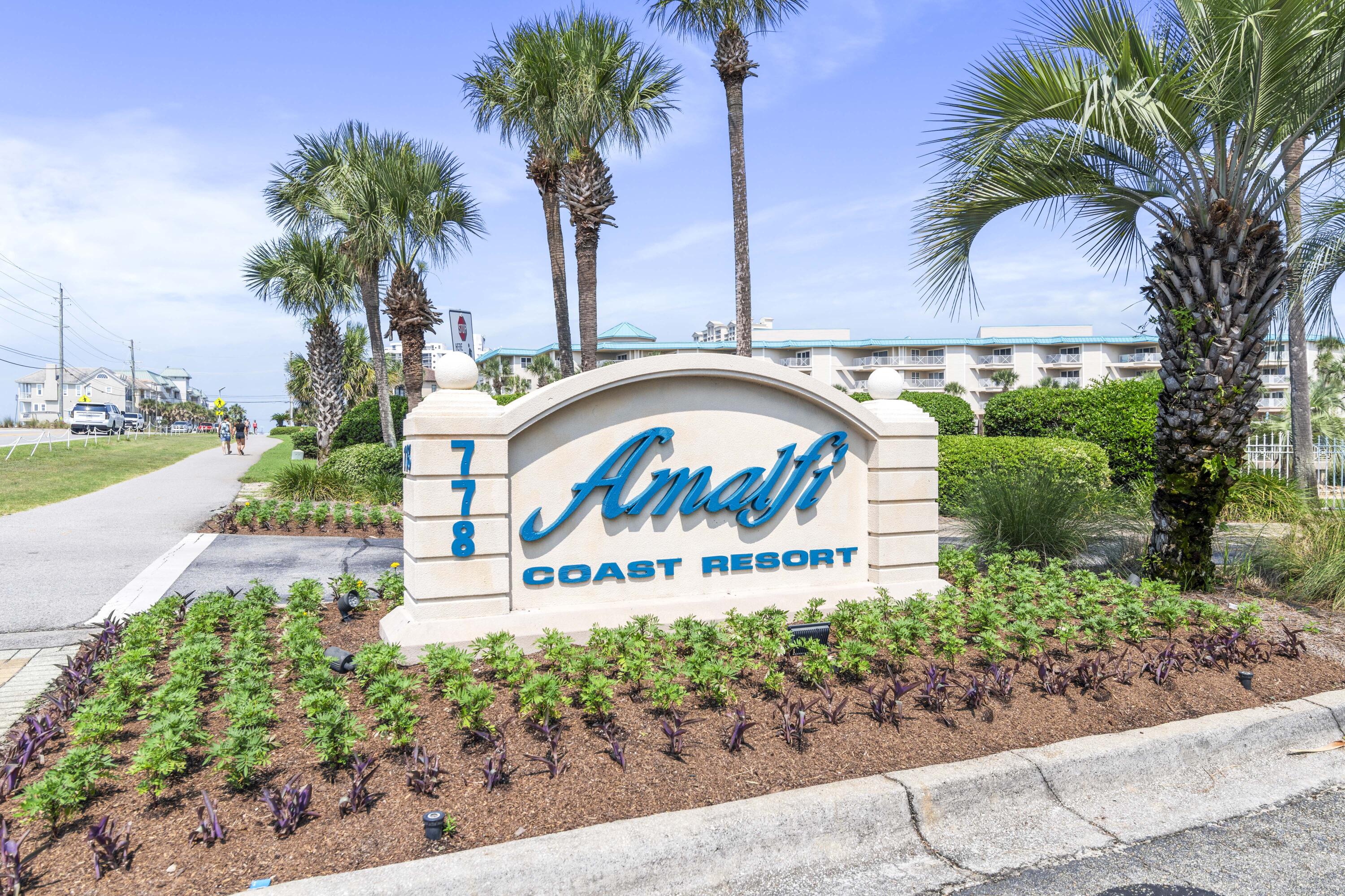 This rental machine boasts annual rental income of 70k+, prime access to over 380 feet of public beachfront, 8+ acres of beautifully landscaped grounds. This unit features two spacious bedrooms, two bathrooms, and hallway bunks. Enjoy gulf views from the primary bedroom and en-suite bath with a walk-in shower. The gated community offers summer security, two pools, a gym, a firepit, and a community room.Conveniently located near dining, shopping, golf, and entertainment, Amalfi Coast Resort combines luxury living with an unbeatable location.OPEN HOUSES - Please call/text the number at the callbox for gate code and instructions