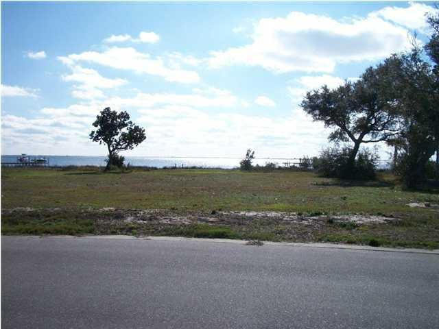 140 feet on the water! This .75 acre lot is located in a private waterfront community. Community is centrally located to beaches, military bases, restaurants and shopping. Check out community amenities!