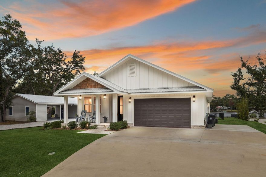 Experience waterfront living at its best on Mallet Bayou with this beautifully maintained three-bedroom, two-and-a-half-bath home plus office offering deepwater access and a private dock, perfect for boating, fishing, and exploring Choctawhatchee Bay just minutes away. Designed for comfort and coastal living, this 2,250-square-foot residence features an open-concept layout with stunning water views from the main living spaces and primary suite. The spacious kitchen connects seamlessly to the dining and living areas, where a glass wall and door system opens completely to the screened back porch, creating a true indoor-outdoor living experience and bringing the bayou breeze right into your home. Step outside to your private dock and deepwater frontage, where you can launch your boat, kayak, or paddleboard directly from your backyard. The two-car garage and dedicated office provide functionality for both everyday living and remote work. Nestled in a quiet bayou-front setting, yet only a short drive to the beaches of 30A, shopping, and dining, this property offers the rare combination of tranquil waterfront living and coastal convenience. Whether you're searching for a full-time residence, weekend retreat, or waterfront investment, 934 Bay Grove Road delivers the lifestyle you've been dreaming of.