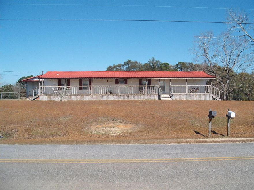 The trailer has been well maintained. There is a shop, 2 enclosed rooms for storage and a three sided hay barn. The property is fenced and cross-fenced. Acreage for livestock. There is a water well on the property for watering animals and the lawn. City water also available.
