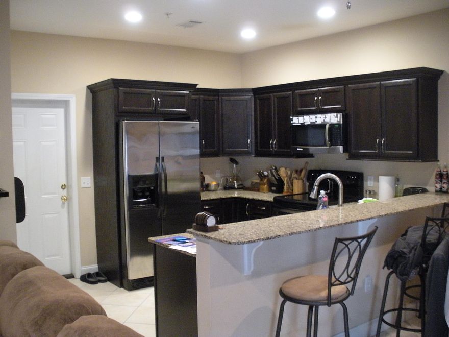 This modern 3 bedroom, 2.5 bath town home has a one car garage and is totally updated! This home has granite counters, as well as granite for the breakfast bar! It boasts stainless steel appliances, and decorative shelving above the cabinets in the kitchen! The seller has purchased over 3 years of home warranty, which is transferable to the new owner for your piece of mind! The lovely 15'' tile on a diagonal makes it more aesthetically pleasing and compliments the counters and cabinets! The seller has just installed a new garage door opener which connects to WIFI and has a battery back-up! He also just installed a new garbage disposal that is super quiet when being operated. The seller has kept all systems functioning properly! He is willing to leave ALL appliances... (Please click)