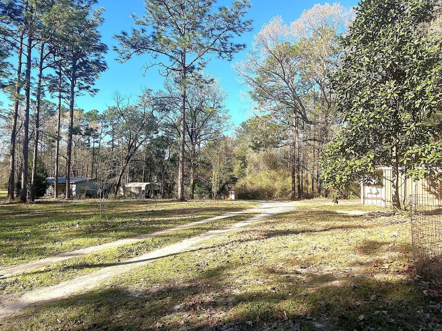 LOCATION, LOCATION! 14.5 ac in popular Eucheeanna Valley. Located less than 5 mi from downtown Defuniak Springs & I-10. Nice mix of cleared land (apx. 4.5 ac) & 10 wooded acres, w/ trails thru-out & apx. 300' of creek ...great attraction for deer & other wildlife. Property is located at the end of a dead-end county maintained road. There are 2 mfd/mobile homes on property being sold in As Is condition ('79, 1288 sf, 2 BR, 2 Bth; '89, 784 sf, 2 BR, 1 bth). Property is priced for the value of the improved land. RV carport at main home w/ electric hook-up; Carport at smaller home w/ electric. 2 power poles, 2 septics, 1 shared well, several outbuildings, including 2 conex containers (1 set up for office area). Please do not go onto property without an agent accompanying you. Shown by appointment only. short notice can usually be accommodated. With some TLC, could be great rental income possibility. Live in one & rent the other. Or live in one while building your dream home. Endless possibilities! Manufactured homes have separate addresses (164 & 166 Miller Rd)