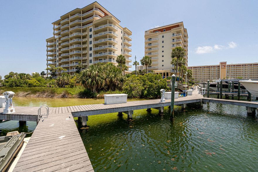 REDUCED PRICE INCLUDES PARKING SPOT AND BOAT SLIP W/LIFT!!! 3 bedroom 3 full bath Harbor Landing West facing condo with boat slip E3, 20 x 40 slip with 16,000 lb boat lift and covered parking spot under the building and storage unit nearby. Enjoy as an income producing vacation rental or pure second home or primary home. Live the beach and Harbor life. Beach access on the sugary white sands of the Emerald Coast. Be in the ocean or Crab island in minutes with your boat in the Worlds luckiest fishing village. Take the water taxi (don't drive) to all harbor events, activities and restaurants. Walk to the beach and enjoy walking or running on the sidewalks on Holiday Isle. Private gated community with private owners pool, a second large pool and hot tub, fitness center and owners room.