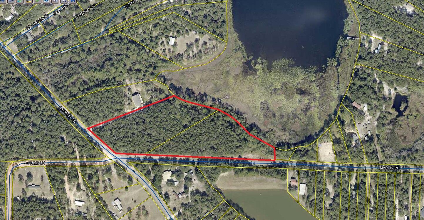 Prime developer site with 9.78 acres (assemblage of two adjacent parcels) and 825 feet of waterfront along Holly Lake just northwest of Defuniak Springs. Subdivide the adjoining parcels into multiple lakefront lots (each over 1 acre) - the possibilities are endless. Enjoy breathtaking sunrises and sunsets while being minutes from the vibrant town of Defuniak Springs, brimming with historic charm, sights, and delicious dining options. For a touch of the coast, pristine beaches of South Walton and the natural wonder of Vortex Spring are less than an hour away. Information is deemed to be reliable; buyer to verify all data for their particular use. No survey