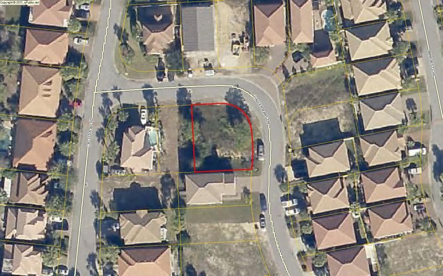 Great corner lot in the gated community of Calusa Bay.