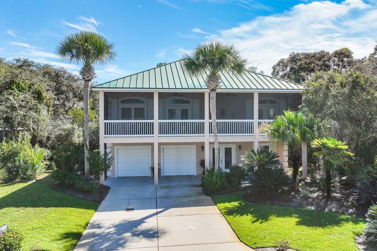 Lakewood Pointe Estates is a non-rental gated neighborhood located south of Scenic 30-A on the Eastern Lake. This is a rare and coveted Coastal Dune Lake where families can enjoy small aquatic watercraft, fishing and swimming, plus an easy walk, bike ride or kayak ride down to the Gulf of Mexico. This Florida Cottage has been meticulously cared for and enjoyed through the years, with expansive front porch and second floor screened in balcony that affords views to the Eastern Lake. The downstairs host two guest bedrooms and a full bath, a large garage with storage. The second level is an open living area to the dining, the kitchen with pantry, plus the master bedroom suite. This is a Great neighborhood you will love to make your second home or primary residence.