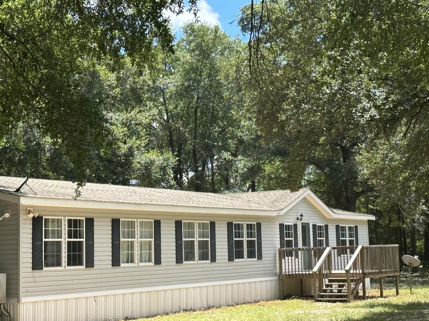 Location WOW! 5 Acres! Quick access to Hwy 90 between Milton and Crestview you pick! Fast access to I-10, Beaches and Bases ! What's across the street ? Blackwater Forest ,no Neighbors there! Just Deer Turkey, Horseback riding and trail to walk and Explore! Bring the Chickens to this Corner 5 acres with Beautiful Live Oaks and a Paved road on 2 sides !  Settle down and enjoy this spacious 4-bedroom home on 5+/- Acres of land, Featuring a Green house, Sheds,shop,carport and a Chicken Coop.  Country Living while still having various options for entertainment or heading for a day at the beach or a trip to the grocery store?  In Santa rosa county and just shy of Okaloosa County