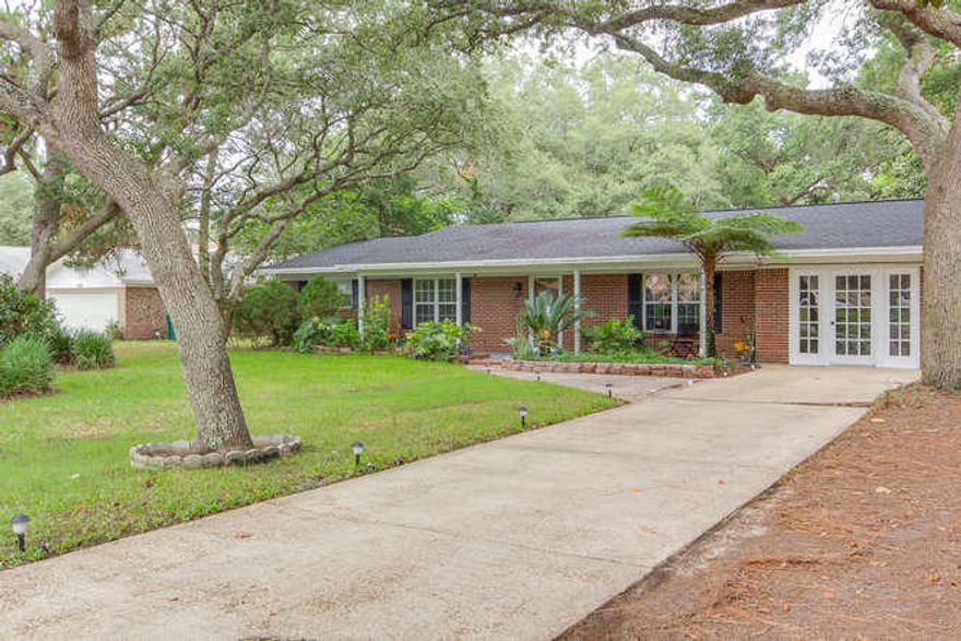 Beautifully renovated 4/2 brick home in a centrally located Ft Walton Beach neighborhood. Oversized kitchen with upgraded granite, white shaker cabinets, GAS cooktop, separate wet bar area with an additional sink, hidden microwave & lots of storage! This 4/2 features 3 large bedrooms on the left wing of the house and an additional 4th bedroom that would make a great office, playroom or guest room on the front of the house with its own set of French doors too! Master bathroom features his & her sinks, an oversized garden tub & separate shower. Plenty of extra space in the bathroom for a make-up vanity or extra storage. Two living areas plus a dining room! Great family home on amazing oversized lot with the most beautiful oak trees and established landscaping. No Flood Insurance Required