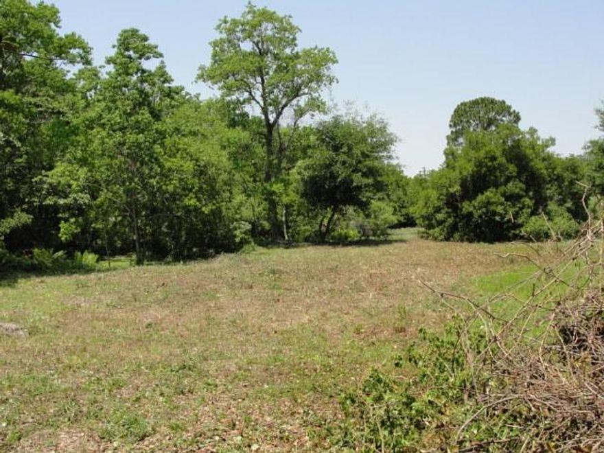 Seller motivated! Hidden treasure! In the midst of an established neighborhood, you'll find this beautiful lot tucked in behind other brand new construction. This lot's shape provides not only plenty of street frontage for a welcoming entrance, but the driveway ''leg'' of the lot takes you back to a private home site with views of the creek, pond and potential bay views from an upper story. You've got to check this one out. It could make the perfect spot for your quiet out of the way oasis in the middle of town.