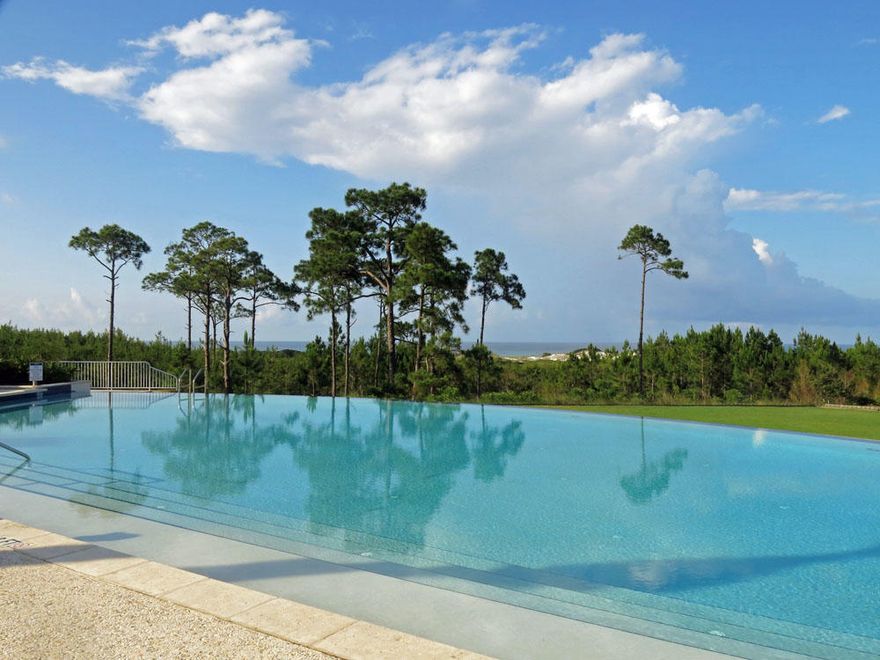 Build your dream home to capture forever-sunset views over Topsail Hill State Park. Lot 48 is unique in the way the topography to the west descends to offer expansive nature preserve and Gulf views, unlike other lots in the community. Situated just steps away from the community's luxury amenity center that offers an infinity pool, hot tub, gym, cover lounge, second level sun deck and owners' clubhouse. Other amenities include tennis courts, recreational lawn, and shuttle service to the beach Memorial Day through Labor Day.Cypress Dunes is located on the west end of Highway 30a, just a quick drive to the shops and dinning at Grand Boulevard.