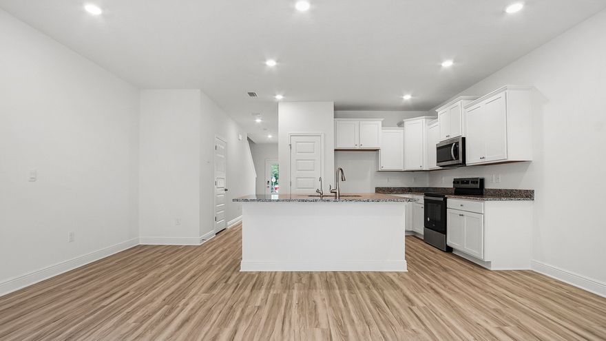 STUNNING MOVE-IN READY TOWNHOME IN PRIME LOCATION!! This welcoming home features 3 bedrooms, 2.5 bathrooms, and a 1-car garage. All bedrooms are located on the second floor, leaving plenty of space on the main level for entertaining and relaxing. Beautiful interior features include EVP flooring throughout the home, elegant tile shower in the primary bathroom, bright white cabinetry in Ivory, a center island with stainless-steel sink, and stainless kitchen appliances which include a stove, microwave, and dishwasher.