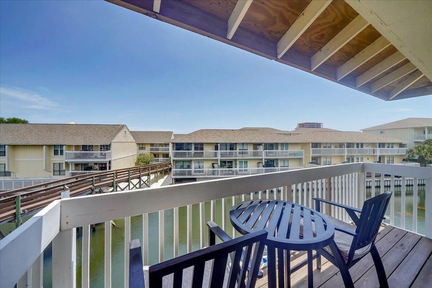 UPDATED and rental ready directly on the SPC Canal! Two new bunks increase the sleep count from 4 to 6! Relax on the deck watching boat activity or just enjoy the water! Updates included new laminate flooring, paint, new furniture in the living room and bedroom, new memory foam mattress in bedroom and sleep sofa, new Smart TVs. SPC is a gated low density residential style resort occupying 43 acres in the heart of downtown Destin featuring 1100 ft deeded beachfront and seasonal beach rental service. Amenities include grill area, 5 pools, 6 tennis courts, canal docking by reservation & availability, marina for long term slip leasing (upon availability), shuffle board, bocci ball, 9 hole par 3 golf course. Restaurants on-site include Louisianna Lagniappe and Rick's Sand Trap.