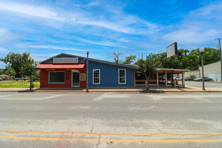 Located in the heart of downtown Crestview, this iconic building offers exceptional visibility and endless potential for your next business venture. With a rich history dating back to the 1950s, the property has been family-owned for over 70 years and most recently operated as a restaurant.Inside, you'll find two distinct indoor spaces ideal for dining, retail, or flexible commercial use, along with two covered outdoor porches--perfect for patio seating or creative expansion. Whether you're envisioning a new restaurant, boutique storefront, or office space, this rare downtown opportunity allows you to breathe new life into a well-loved local landmark.Explore the possibilities and make this space your own.3D floor plan available for layout and room dimensions.