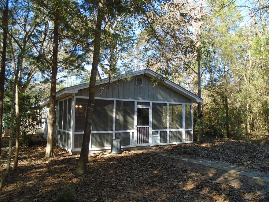 THAT PERFECT PLACE IN THE COUNTRY!! This home is located on 2 fenced acres and just a short 15 minute drive from DeFuniak Springs. Home is a 3 bedroom, 2 bath in great condition. Screened porch across the front of the house. All appliances are included. Plenty of closets that line the hallway. 50 gallon water heater. Property includes a barn and workshop, chicken coop, plant potting building plus well house. Plenty of space for a garden. Lots of flowering scrubs and stately trees. It's all here!! Seller is willing to assist with closing costs.