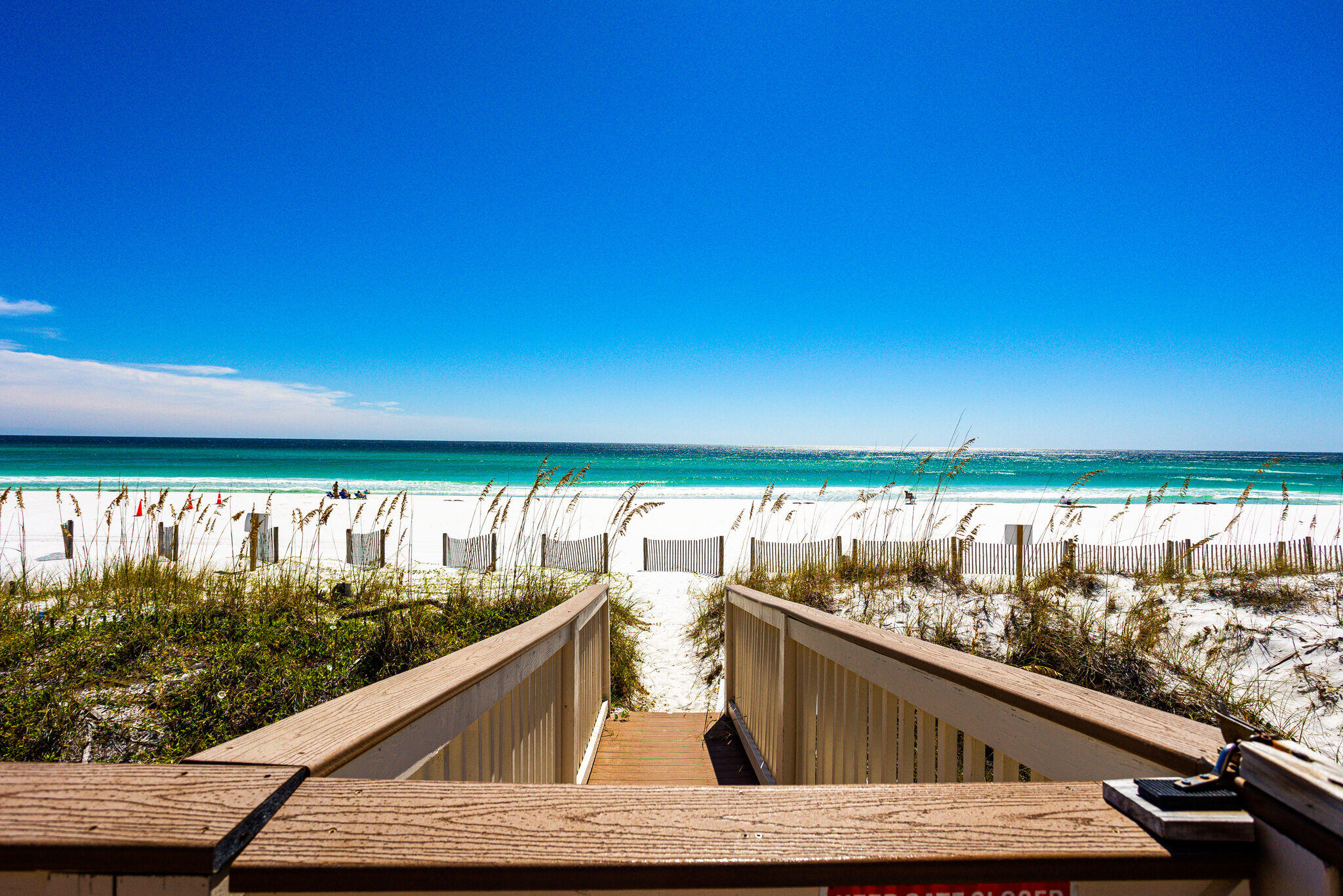 WELCOME to Paradise - This 5 bedroom, 31/2 bath townhome can be a rental machine with gross rental income of $175K - $250K. On the main floor, the kitchen with a breakfast bar opens to a huge living room dining room combination and then out to the 225 sq. foot deck with spectacular gulf views. The top floor has the main bedroom with a sitting area and the main ensuite bathroom. This bedroom has its own private 200 sqft deck overlooking the beautiful water and the sugar white sand. From this deck you can see the coastline from Destin all the way to the Jetties to the west and to Panama City Beach to the east. There is second bedroom with an ensuite bathroom and an additional bunk room.The first floor Beach level was newly renovated. It now boasts a new queen bedroom with amazing gulf ...