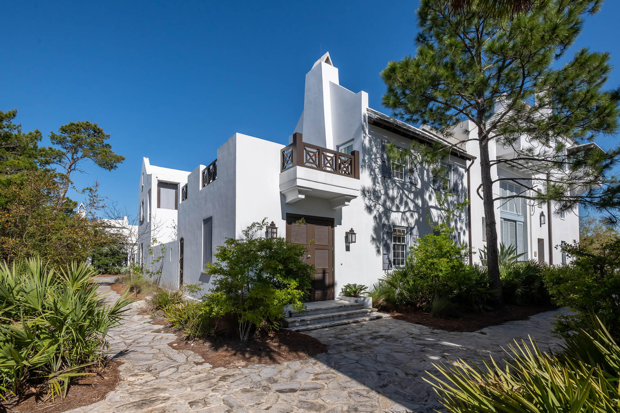 Architect Floyd McCollum created the quintessential Antiguan influenced home that Alys Beach personifies.  This courtyard home is situated on a corner homesite featuring 3 bedrooms & 3.5 bathrooms of which one is a private Casita having its own roof terrace perfect for sunning & star gazing by light of the terrace's fireplace.  The home surrounds a southern facing private courtyard with pool & dining loggia.  All common areas of the home have views of this private outdoor space which transfers natural light from outdoors to in.  The 1st level is all common area connecting the kitchen, dining, and living room, with fireplace, making for an environment to gather.  The kitchen features professional appliances centered with a large island looking upon the dining & living areas keeping the