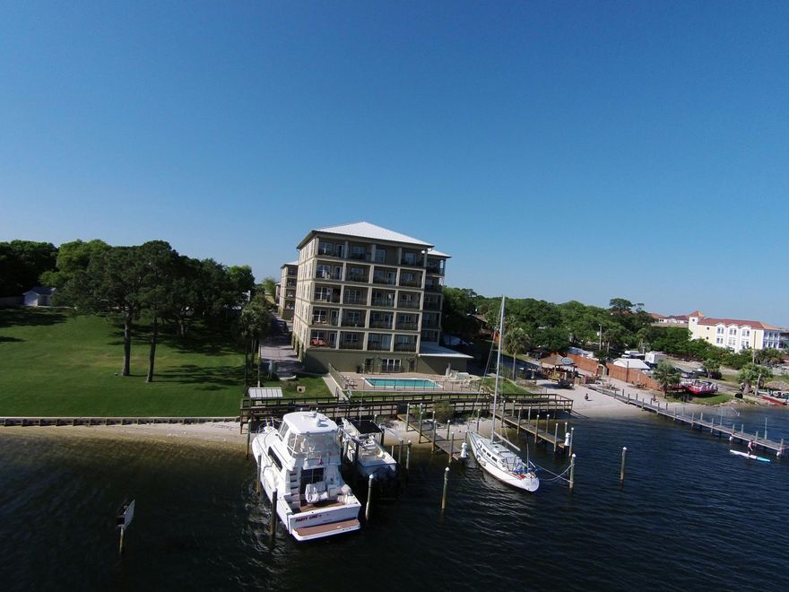 New pricing! Huge waterfront Condominium in a great location with fantastic views! This unit has the best views of the Santa Rosa Sound facing the sunset! This spacious 3 bedroom and 3 full bath luxury condo is situated on the waters of the beautiful downtown restaurant row area of Fort Walton Beach. The downtown area of Fort Walton Beach is going through a period of positive growth which should provide increasing values for years to come! The amenities are what you find in condo projects selling for much more. As you arrive at Sailwatch Landing, the security is evident with gated entryways to all common areas. There is a gym and pool area. This unit comes with a private garage and large storage facility. Large balcony is great for entertaining. Boat slip and extra garage available!
