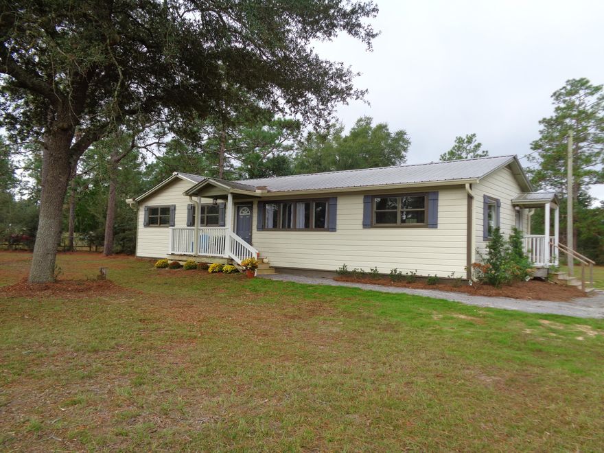 PRICE REDUCED!! Located on 2 acres in North Walton County, Home remodeled in 2017. All new kitchen with stainless steel appliances including dishwasher, smooth top stove with microwave and side by side refrigerator with dispensers for ice and water, new cabinets,countertops and double sink. Laundry closet is off of kitchen. Fresh paint throughout, new light fixtures and complete redo of both baths. Some new flooring. New back 10x16 deck to enjoy grilling those burgers and steaks! Front deck is 13x6. All new insulated windows. Metal roof was installed approx. 5 years ago. New landscaping in the front. All of this with 2 acres. perfect for gardening, adding a pool or just enjoying some of your own space. RV hookups in back of property. This is a ''stick built'' home.