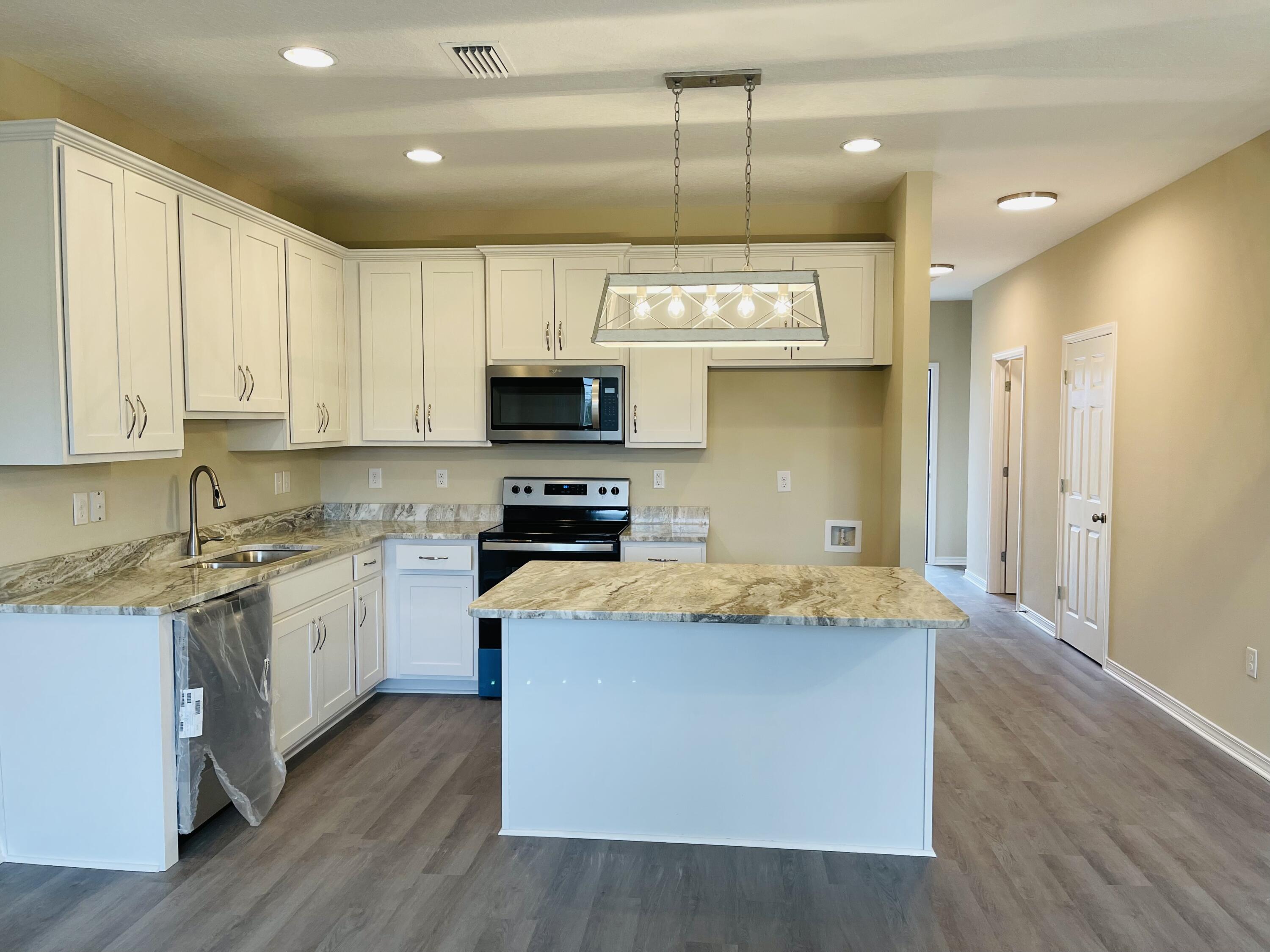 Available for move in immediately! Brand new 3 bedroom / 2.5 bath townhomes centrally located in Crestview. Open floor plan downstairs for easy entertaining. Granite counters tops, LVP throughout. Small pets upon approval. Lawn maintenance included.