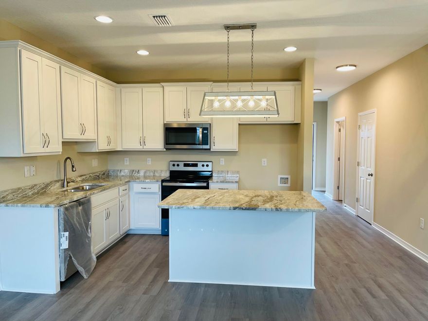 Available for move in immediately! Brand new 3 bedroom / 2.5 bath townhomes centrally located in Crestview. Open floor plan downstairs for easy entertaining. Granite counters tops, LVP throughout. Small pets upon approval. Lawn maintenance included.