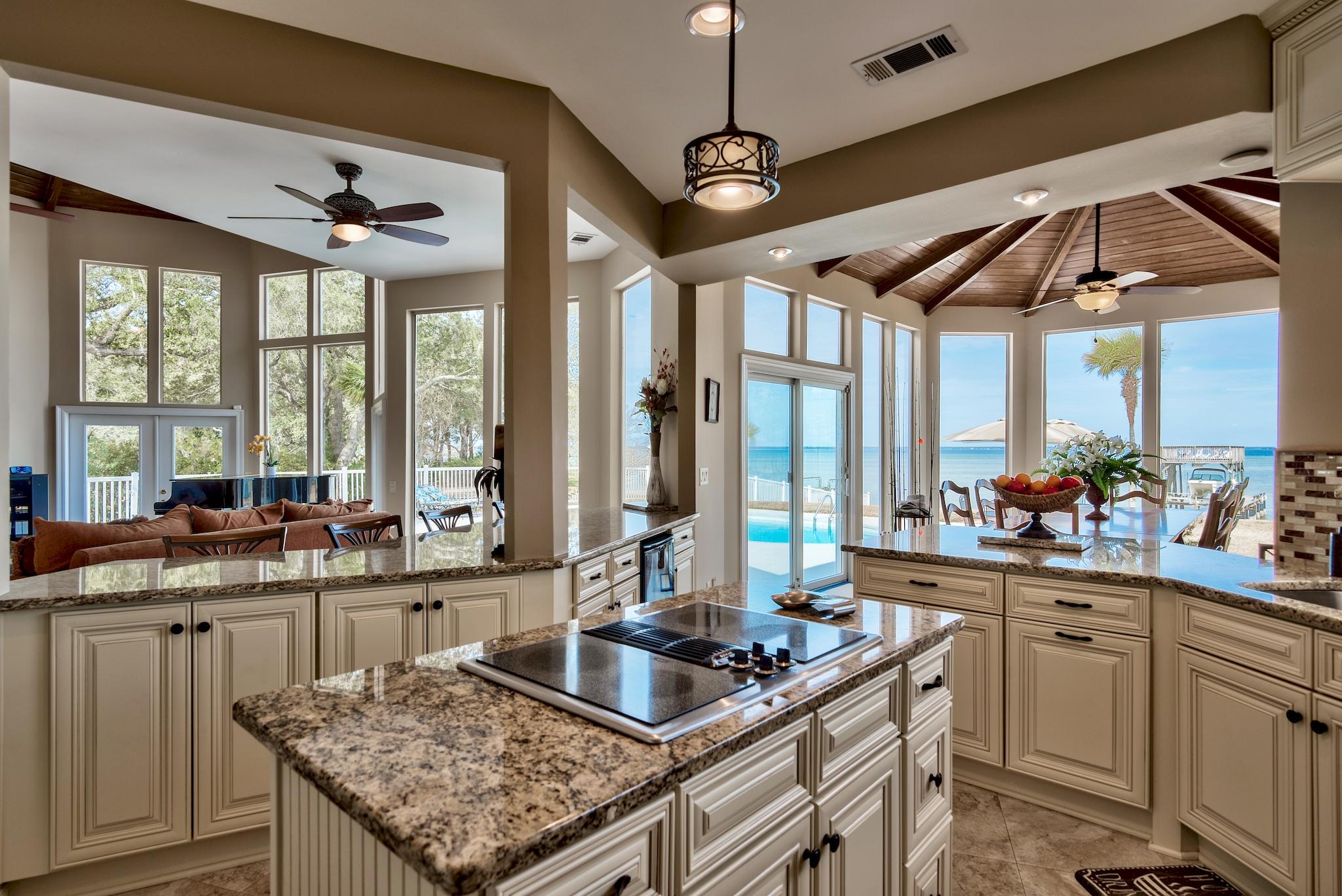 Panoramic Wide Water Views! Absolutely the CLOSEST property on southside of bay to Destin Pass that is rated Flood Zone X and Category 5 Evacuation! Boating to Destin Pass, Destin Harbor and Crab Island in just minutes! Over $350,000 in Renovations! Large Estate Lot can be subdivided! Estate is about fun, boating, fishing, relaxing, entertaining, seclusion and quality of life!