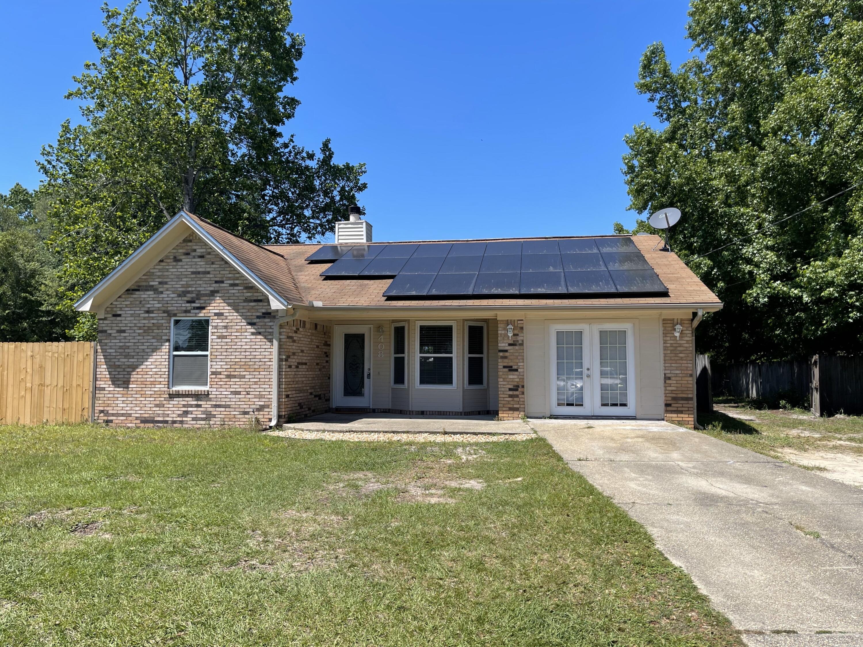 Home south of I-10 on a large level lot in Crestview. Just minutes to Seventh Group and 20 minutes to Eglin. New LVP in living Rm with neutral color pallet. This home features a beautiful wood burning fireplace, tile floors, tankless water heater. This home has 4 bedrooms with a closed in garage as a flex/bonus room. The master bedroom is huge with a massive walk in closet. There is a large, flat backyard with a privacy fenced and yard building out back. NO CATS