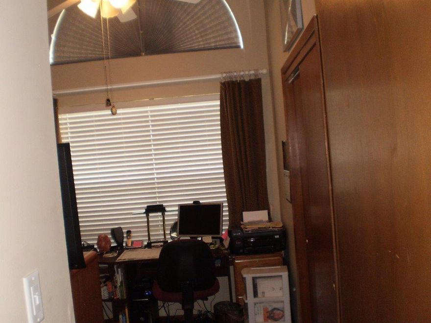 Why Rent, when you can own this spacious and open floor plan with cathedral ceilings in the living area and both bedrooms. Also featured are breakfast bar, brick fireplace in main living area, large walk-in closet in master bath, and an inside utility room. Step out back to the nice privacy fenced back yard with oversize patio.Don't miss this one.