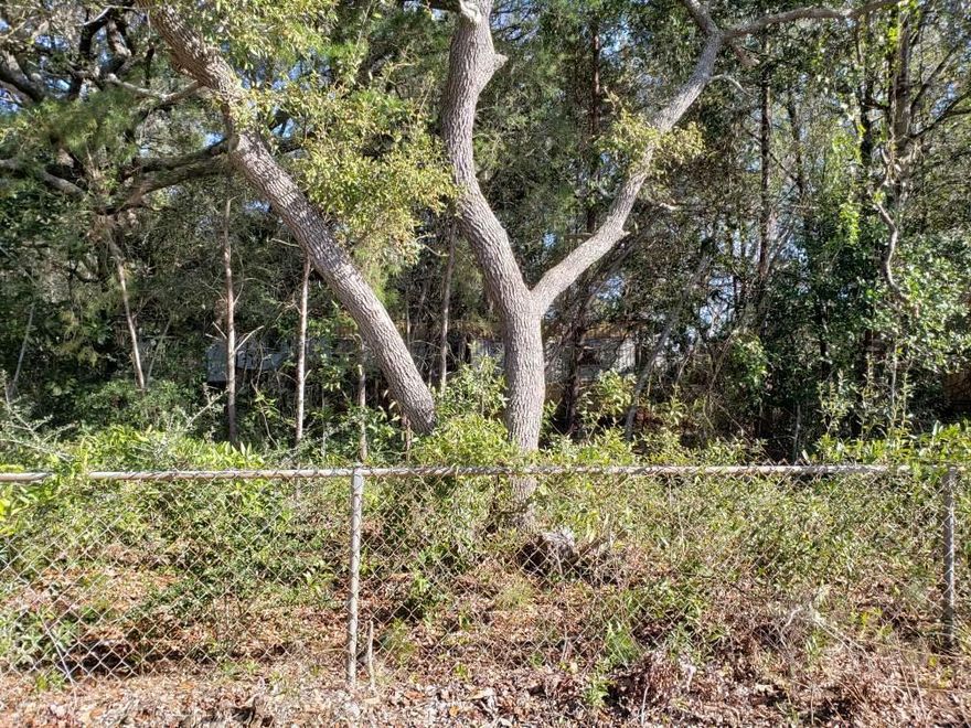 Motivated seller! Bring us offers! 4 Lots in one parcel. 4 water and sewer taps on property. Trailers have no value. Close to shopping and schools. 3 miles from Hurlburt Field's main gate and less than 1/2 a mile to the fire station.  All information should be verified by buyer.