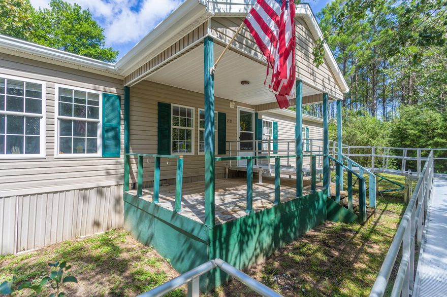 Quiet country living on 5.4 acres, nestled in the Northwest Florida pines on a paved county road with a long private circular drive. Conveniently located 15 minutes from Crestview, 25 minutes from Niceville, 20 minutes from Defuniak Springs, 5 minutes from I-10, 35 minutes from Eglin Air Force Base, and Duke Field. The 24'36' pole barn features a concrete slab and a 24'X13' enclosed workshop with electricity. There is a smaller portable shed that provides additional space for storage. Property is currently served by city water, but does have a well onsite that could be repaired and put back in use.  Front and back covered porches provide nice shade where you can enjoy true country living.