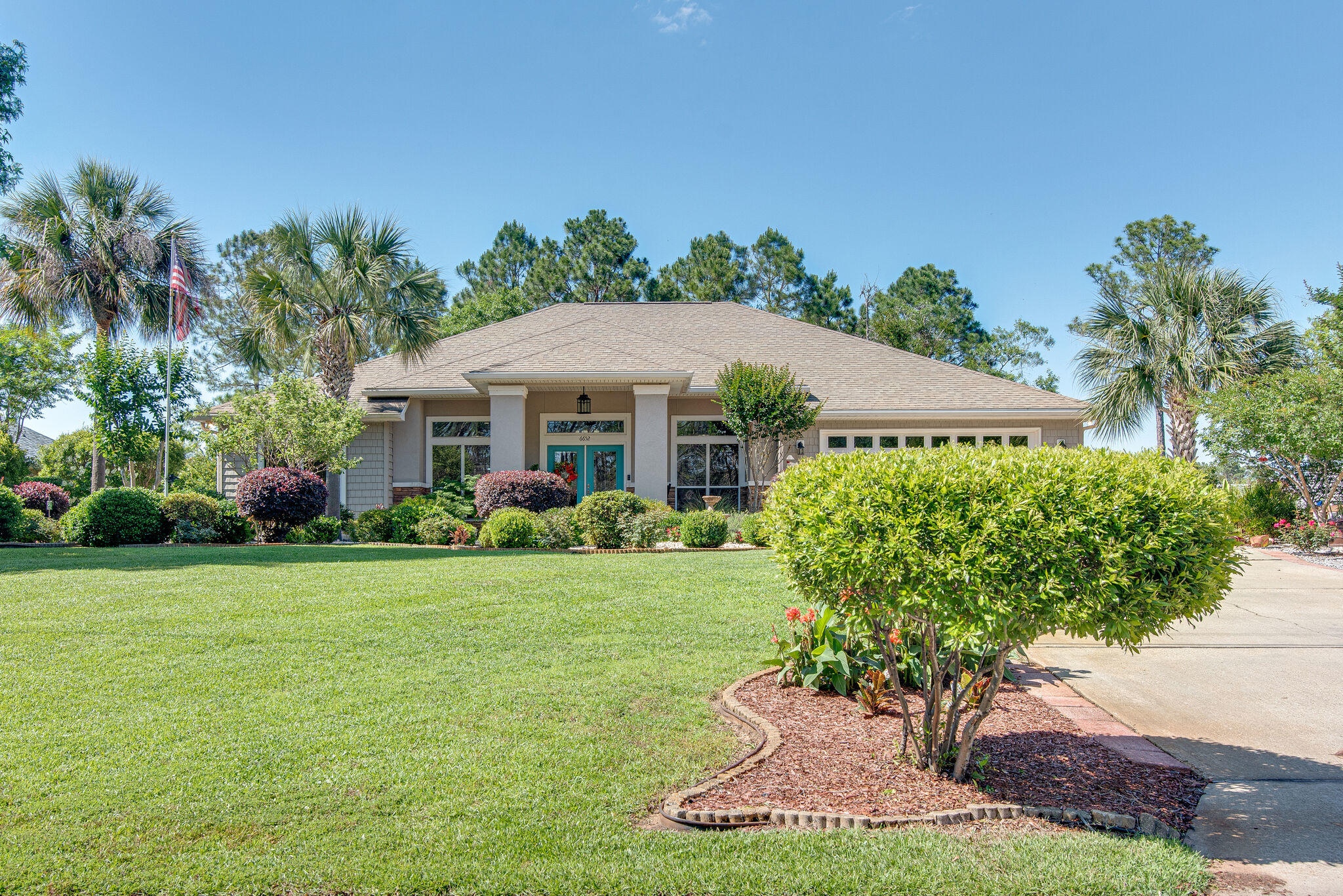 This gorgeous home tucked away on a secluded street is a step into the serenity of the Florida coast. Located on Whiteoak Bayou in the Avalon Beach area, this home provides stunning views of the wildlife while also being just a short drive to the major shopping and dining areas of Pace/Milton. Inside you will find beautiful hardwood floors, a kitchen with wrap-around island and hanging range hood, and a breakfast nook area with bay window. The master suite is a perfect indoor getaway with new flooring and a spa-style ensuite with double vanities, separate shower and tub. The split floor plan provides privacy for all occupants of the home, while also giving you plenty of room to spend quality time together in the living area or on the enclosed back porch.