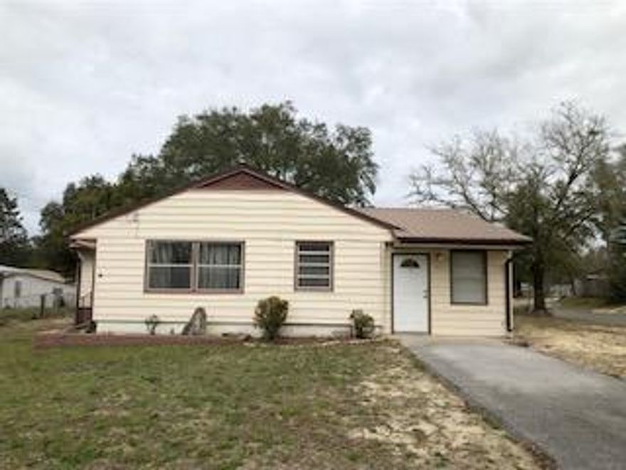 Single story 3 bedroom/2 bath house on large corner lot in Valparaiso -- just a few minutes to East Gate at Eglin AFB. Metal roof and siding. Large lot with partial fencing - with double gate for recreational vehicle access/storage. New HVAC system. Large kitchen/eating area. Vinyl protective window coverings for hurricanes. Whole house generator for loss of power. $4,000 flooring allowance for buyer. A smart starter home or investment. Make an offer!!